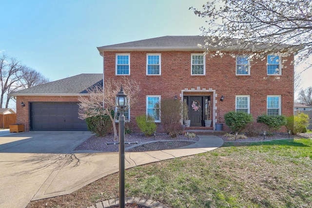 8623 Newbury Rd, Evansville, IN 47725 - colonial home with brick siding, driveway, a garage, and a shingled roof
