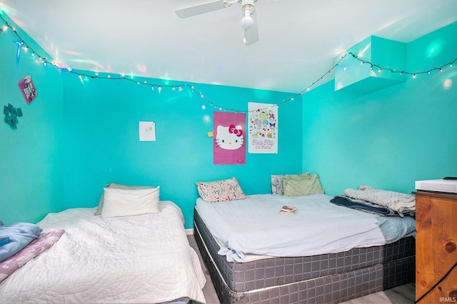 bedroom with ceiling fan and wood finished floors