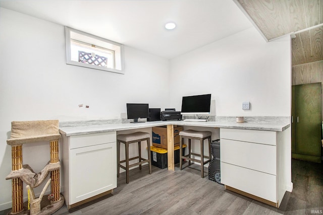 home office with wood finished floors
