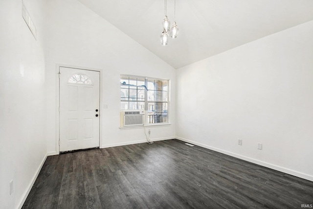 entrance foyer featuring high vaulted ceiling, baseboards, dark wood-type flooring, cooling unit, and a notable chandelier