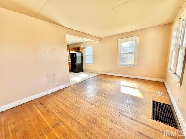 5011 Big Cynthiana Rd, Evansville, IN 47720 - spare room featuring hardwood / wood-style floors, baseboards, and visible vents