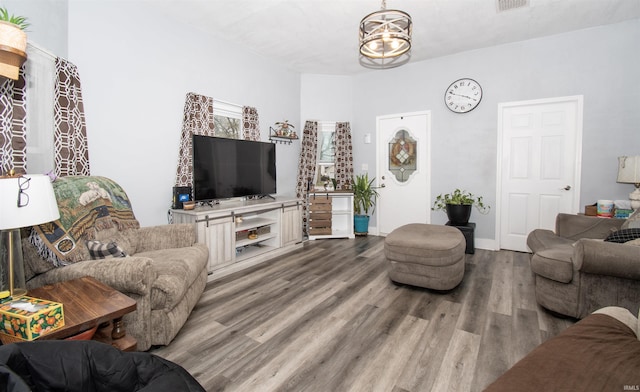 908 S Main St, Kendallville, IN 46755 - living room with baseboards, visible vents, wood finished floors, and a chandelier