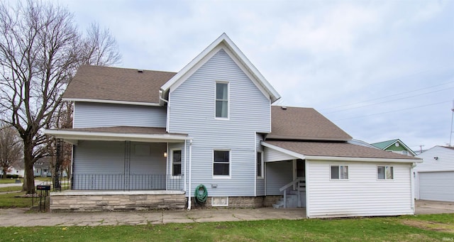 908 S Main St, Kendallville, IN 46755 - back of house with an outdoor structure, a porch, and roof with shingles