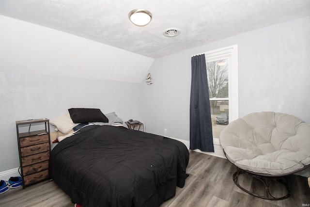 908 S Main St, Kendallville, IN 46755 - bedroom with baseboards, lofted ceiling, and wood finished floors