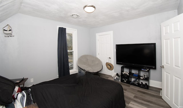 908 S Main St, Kendallville, IN 46755 - bedroom featuring baseboards, visible vents, and wood finished floors