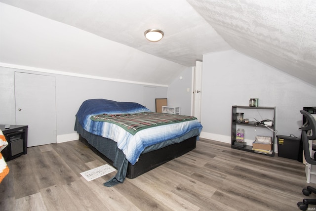 908 S Main St, Kendallville, IN 46755 - bedroom with lofted ceiling and wood finished floors