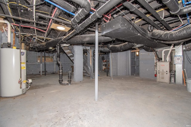 908 S Main St, Kendallville, IN 46755 - unfinished basement featuring heating unit, gas water heater, and stairway