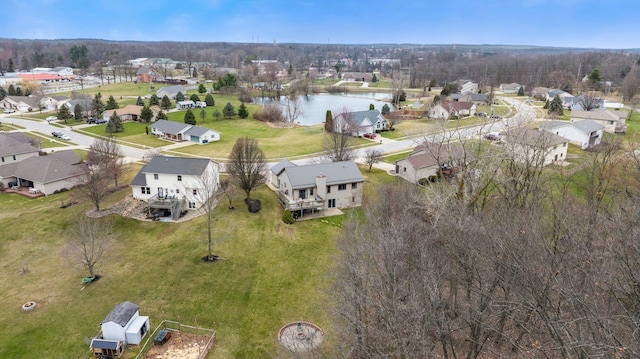 aerial view featuring a water view and a residential view