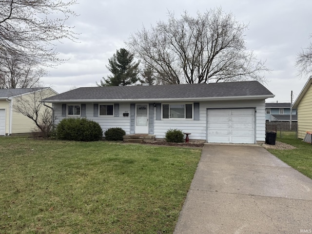 ranch-style home with concrete driveway, fence, a front yard, a garage, and a shingled roof