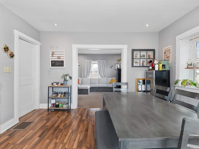 dining space with baseboards, visible vents, recessed lighting, and dark wood-style flooring
