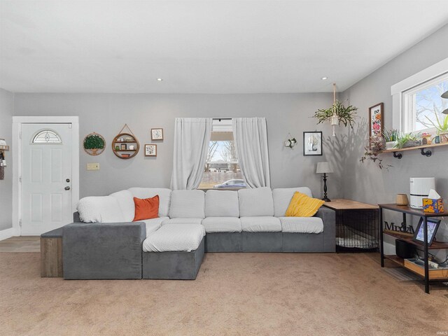 living area with plenty of natural light, carpet, and recessed lighting