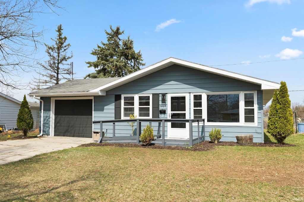 ranch-style house with a porch, driveway, a garage, and a front lawn