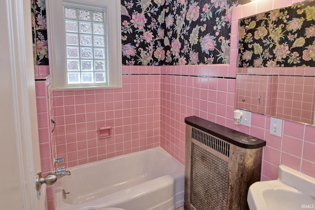 bathroom with tile walls and radiator heating unit