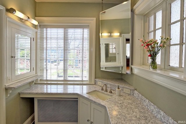 bathroom featuring vanity and plenty of natural light