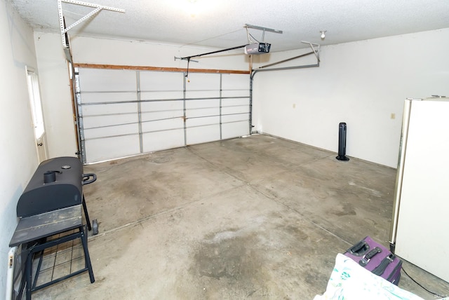 7224 E Gum St, Evansville, IN 47715 - garage with a garage door opener and freestanding refrigerator