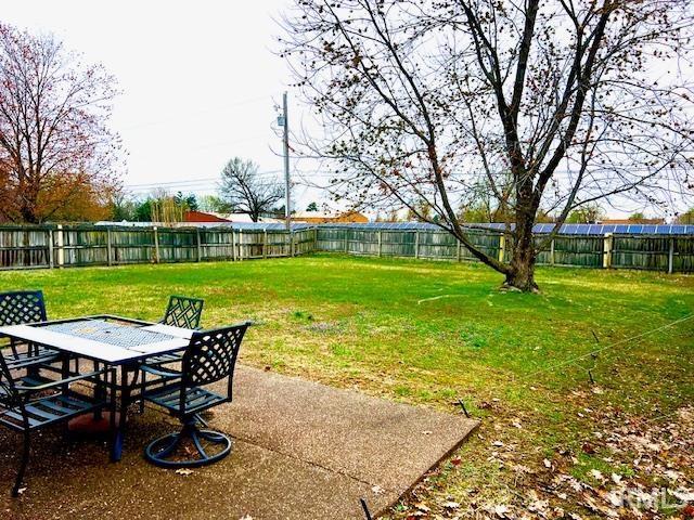 7224 E Gum St, Evansville, IN 47715 - view of yard featuring a fenced backyard, a patio area, and outdoor dining space