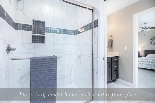 bathroom featuring ensuite bathroom, baseboards, a ceiling fan, marble finish floor, and a stall shower