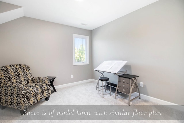 carpeted office space with visible vents, baseboards, and vaulted ceiling
