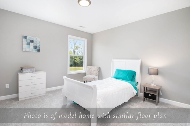 carpeted bedroom featuring baseboards