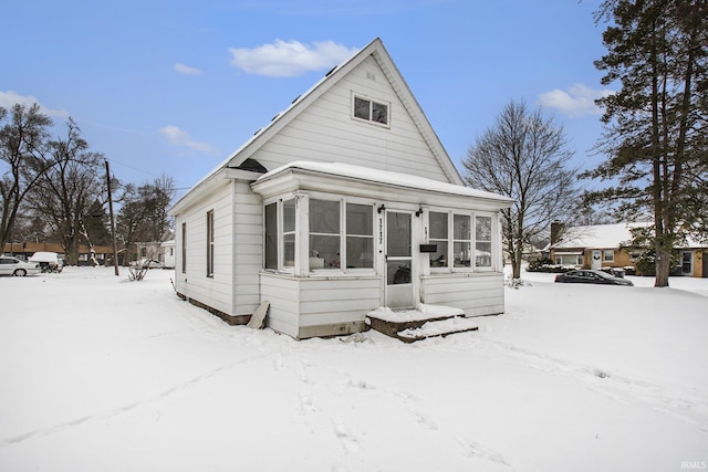 view of front of home featuring a sunroom