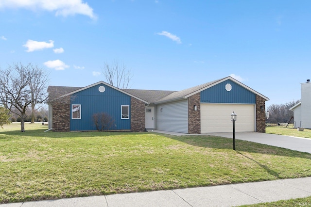 view of front facade with driveway, a front lawn, and an attached garage