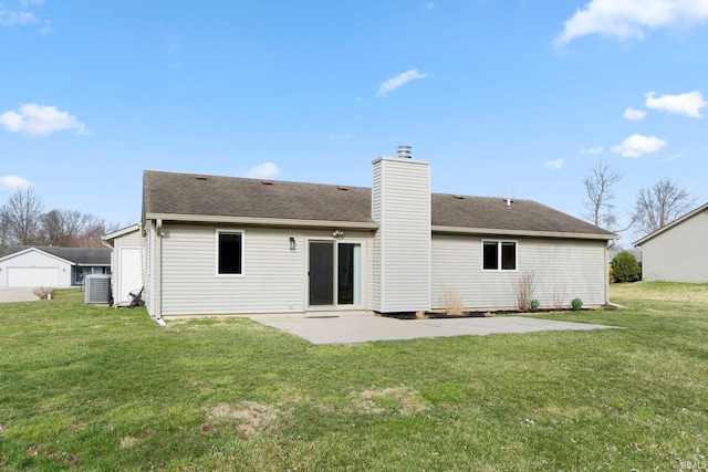 back of property featuring a patio area, roof with shingles, a chimney, cooling unit, and a yard