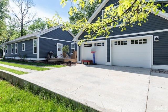 view of front of property with driveway and a garage
