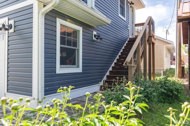 view of side of home with stairs
