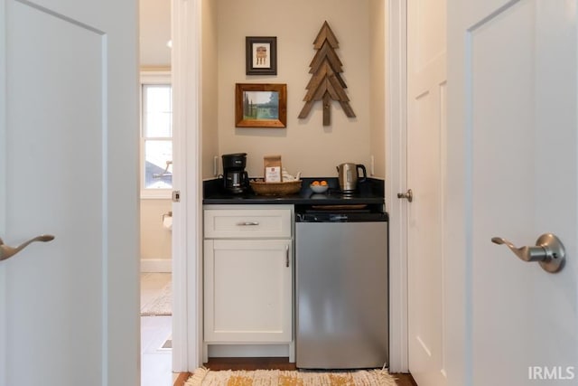 bar featuring a dry bar and refrigerator