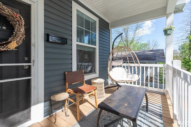 wooden deck featuring covered porch
