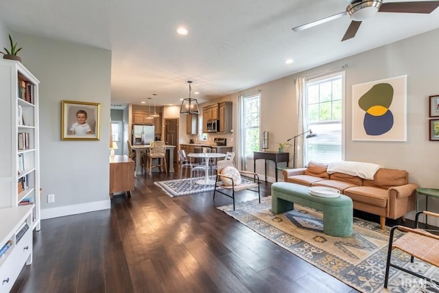 living area featuring dark wood-style floors, recessed lighting, ceiling fan, and baseboards