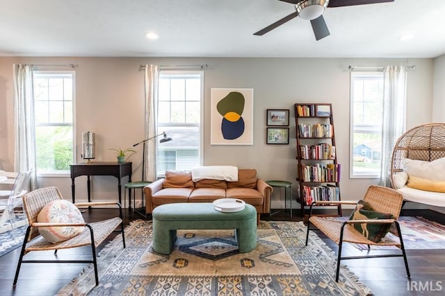 living area featuring a wealth of natural light, wood finished floors, recessed lighting, and a ceiling fan