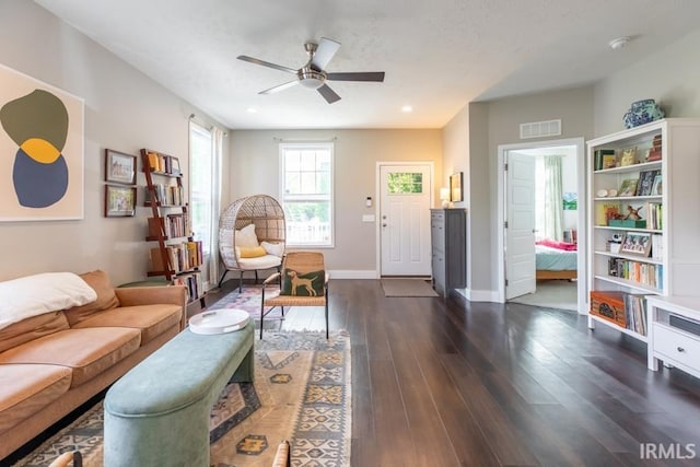 living area with recessed lighting, dark wood-style flooring, baseboards, ceiling fan, and visible vents