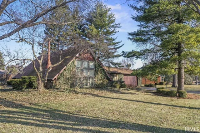 view of property exterior featuring a yard