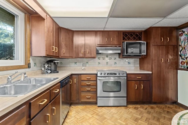 kitchen with a sink, black microwave, stainless steel range with electric cooktop, dishwashing machine, and under cabinet range hood
