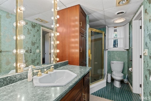 bathroom featuring vanity, toilet, a shower stall, wallpapered walls, and visible vents