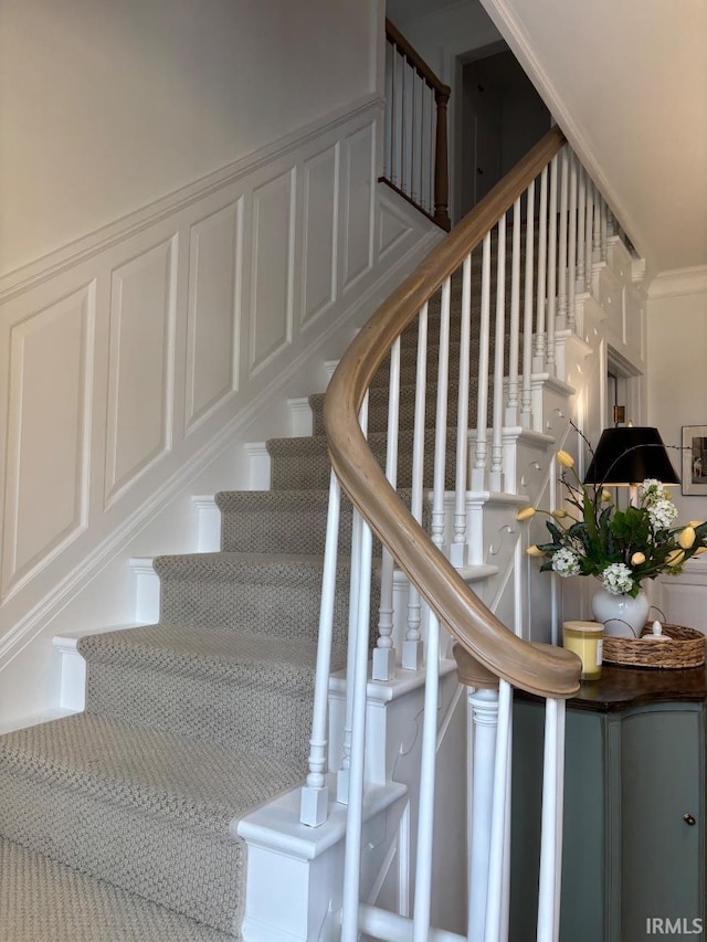 staircase with crown molding