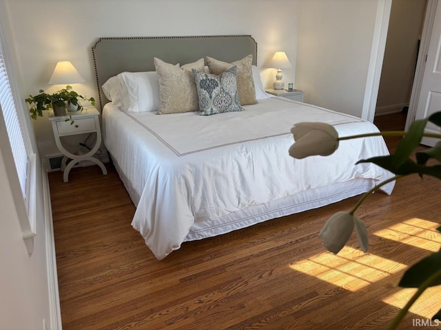 bedroom with wood finished floors