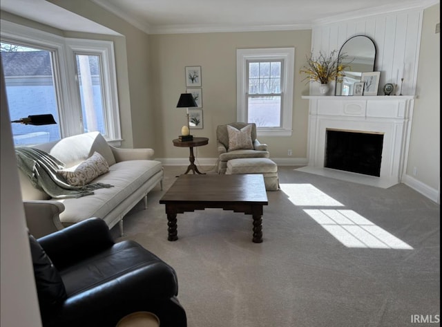 living room with baseboards, carpet flooring, a fireplace, and crown molding