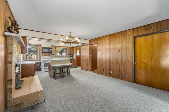 7990 S 150 E, Wolcottville, IN 46795 - interior space featuring a chandelier, wooden walls, and light colored carpet