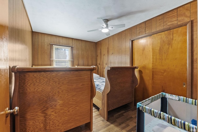 7990 S 150 E, Wolcottville, IN 46795 - bedroom with wood finished floors, ceiling fan, and wood walls