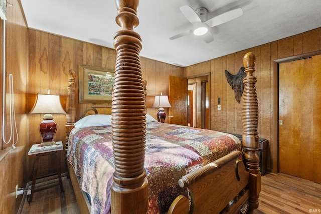 7990 S 150 E, Wolcottville, IN 46795 - bedroom with ceiling fan, wood finished floors, and wooden walls