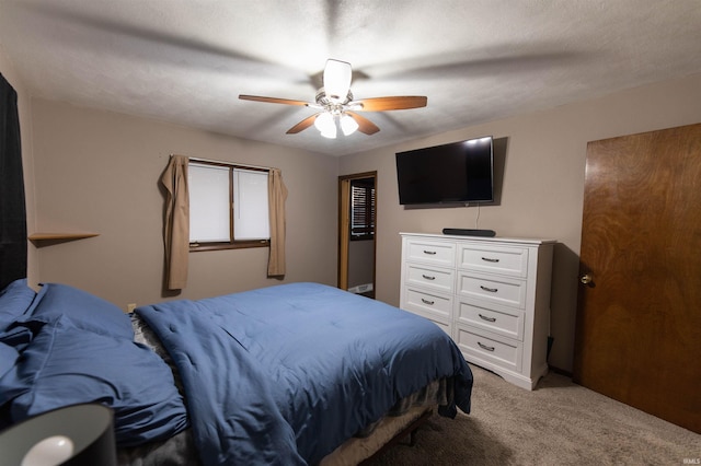 bedroom with a ceiling fan and light carpet
