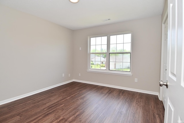 3843 S Bushmill Dr, Bloomington, IN 47403 - unfurnished room with baseboards and dark wood-style floors