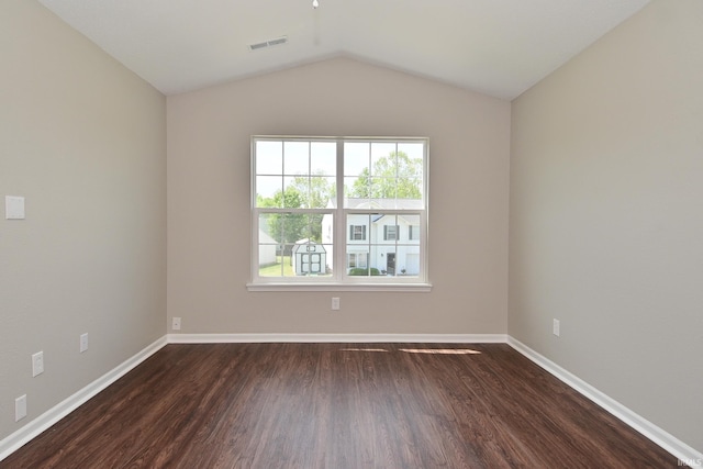 3843 S Bushmill Dr, Bloomington, IN 47403 - spare room with dark wood finished floors, baseboards, and vaulted ceiling
