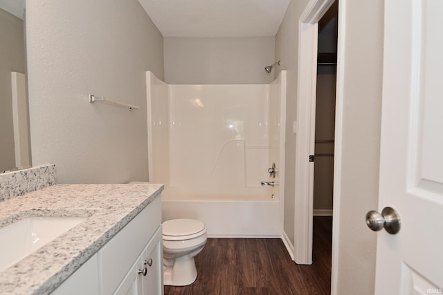3843 S Bushmill Dr, Bloomington, IN 47403 - full bathroom with wood finished floors, toilet, vanity, and shower / washtub combination