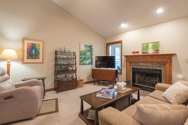 carpeted living area with baseboards, high vaulted ceiling, and a brick fireplace