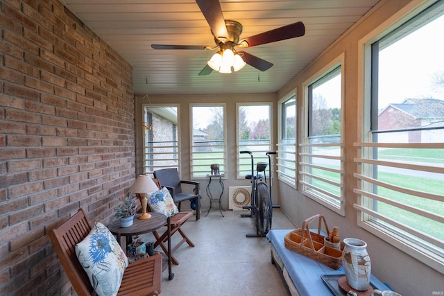 sunroom with plenty of natural light and ceiling fan