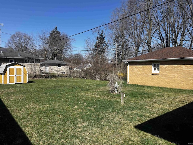 view of yard featuring an outbuilding and a shed