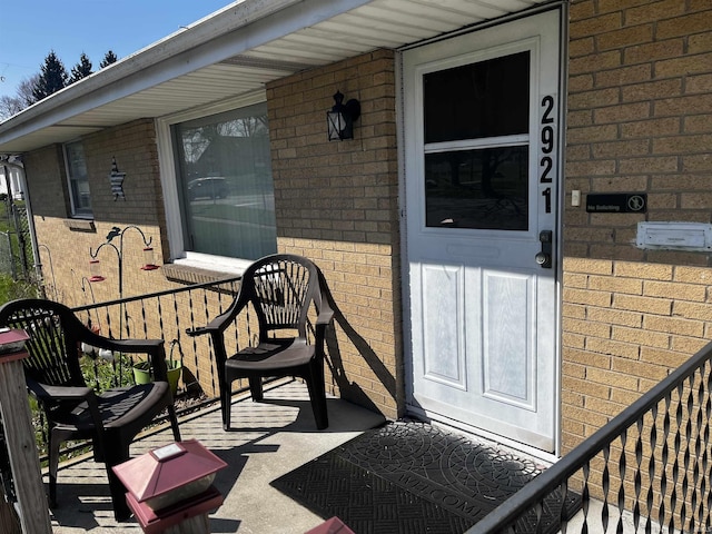 entrance to property with brick siding